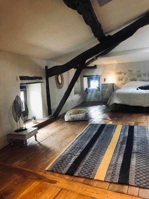 Postel nebo postele na pokoji v ubytování L'Oree du Ciel