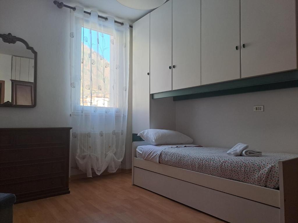 Postel nebo postele na pokoji v ubytování Appartamento A Càsa dei Nòni