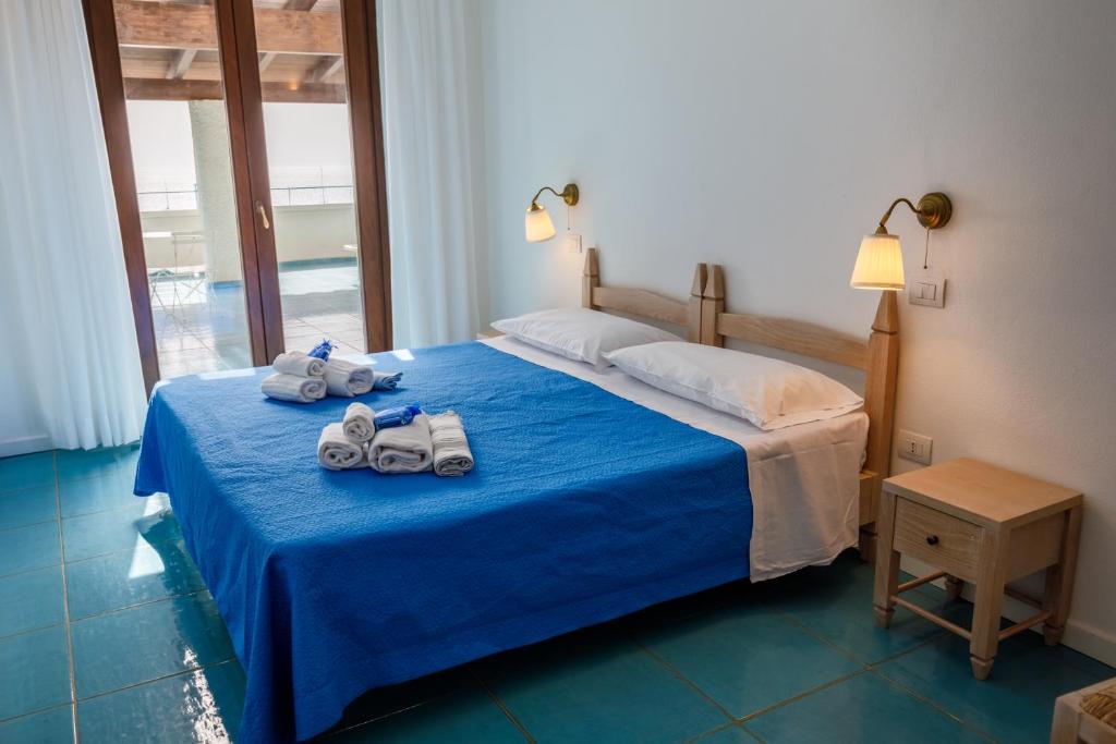 Postel nebo postele na pokoji v ubytování Villa Tre Mari