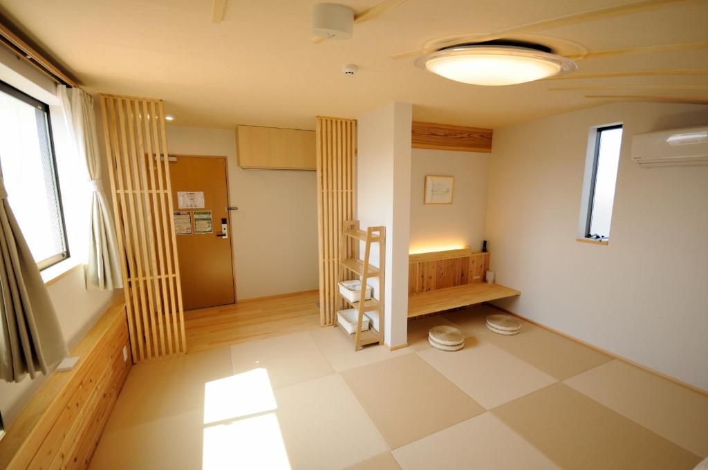 Postel nebo postele na pokoji v ubytování KAYO NIJO Hotel
