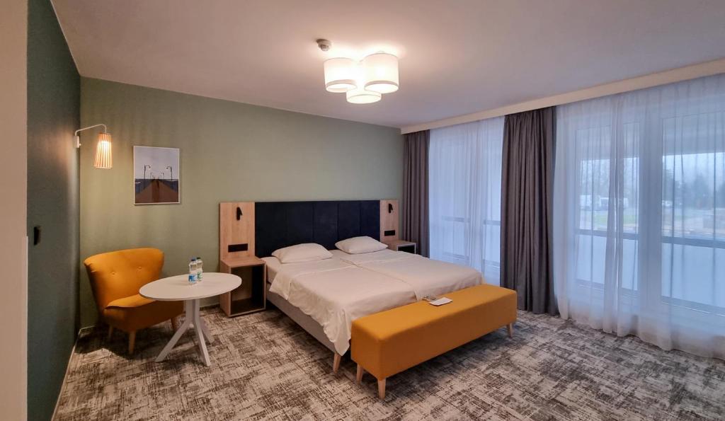 Posteľ alebo postele v izbe v ubytovaní Hotel Wolin