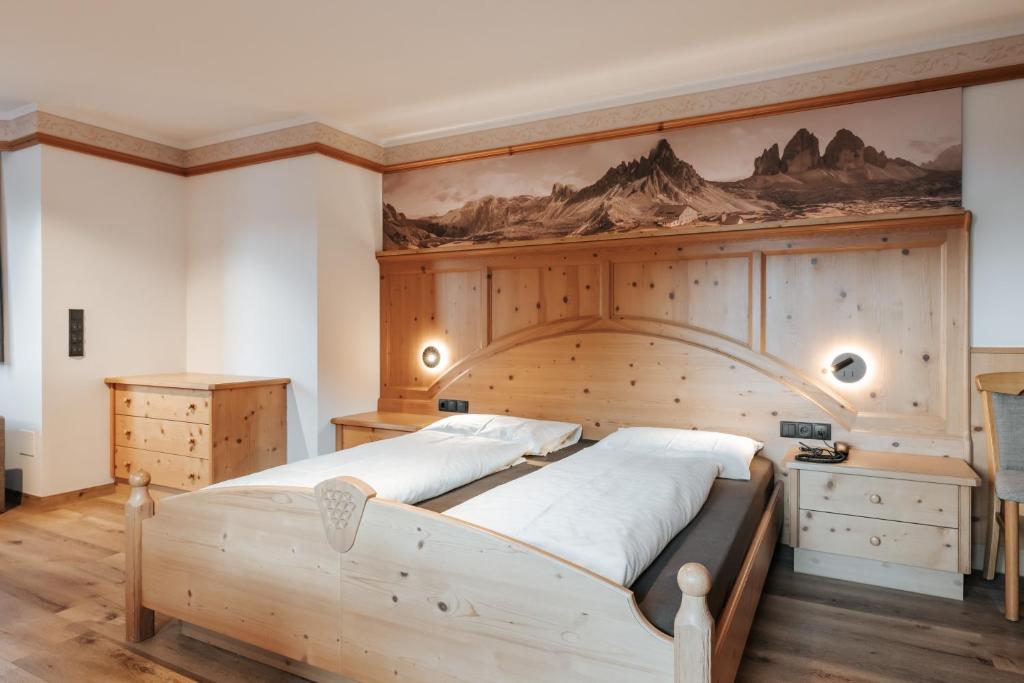 Postel nebo postele na pokoji v ubytování Hotel Tannenhof