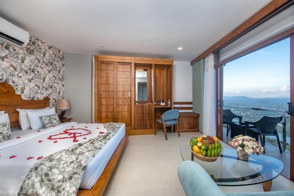 Postel nebo postele na pokoji v ubytování Ceyloni Panorama Resort