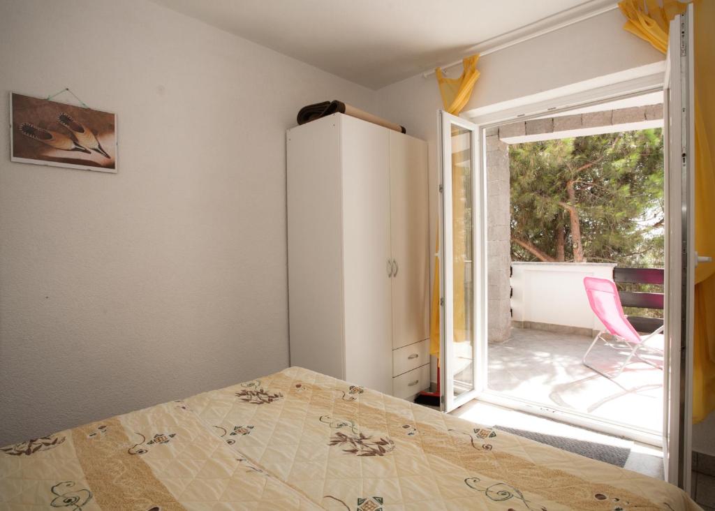 Posteľ alebo postele v izbe v ubytovaní Apartments Vrgada