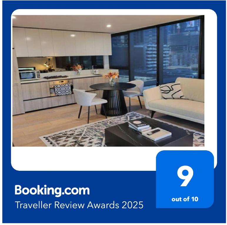 Hotel Stunning 2 bedrooms - Southbank, a living room with a couch and a table at Stunning 2 bedrooms - Southbank in Melbourne