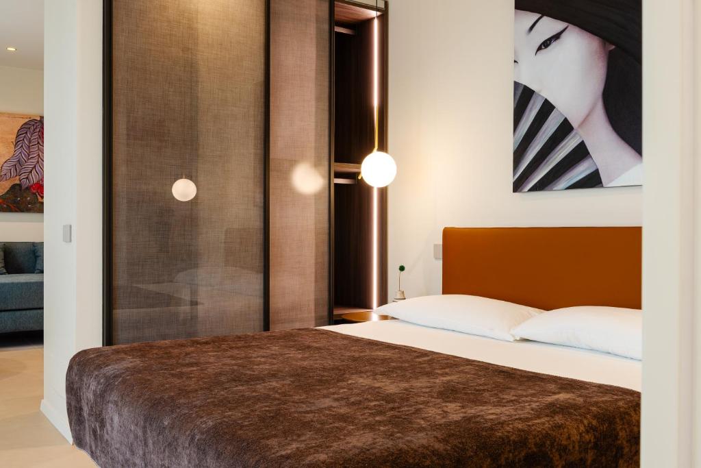 Postel nebo postele na pokoji v ubytování Hera Rooms and Suites