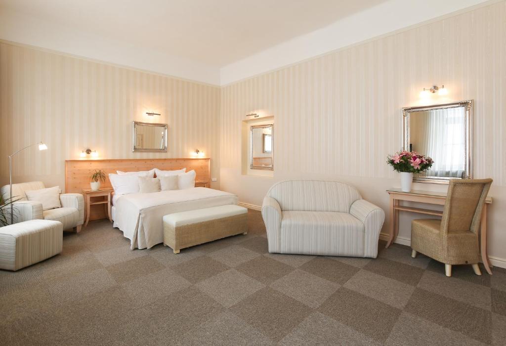 Postel nebo postele na pokoji v ubytování Unitas Hotel