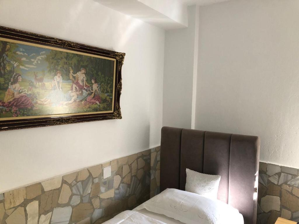 Postel nebo postele na pokoji v ubytování Geni Guest House