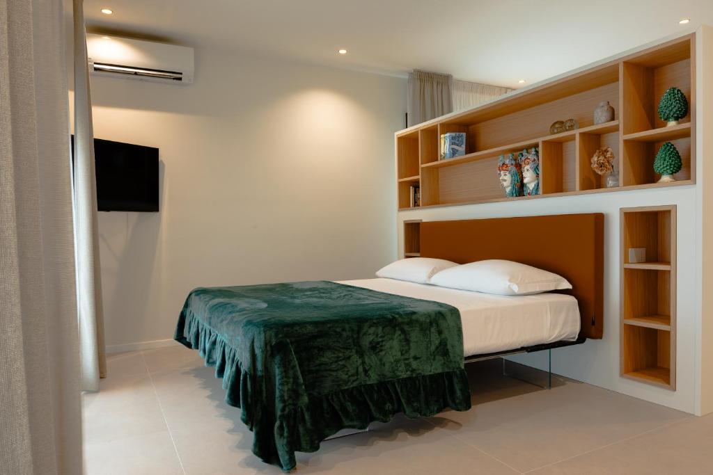 Postel nebo postele na pokoji v ubytování Hera Rooms and Suites