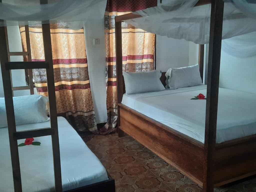 Postel nebo postele na pokoji v ubytování AMESbungalows