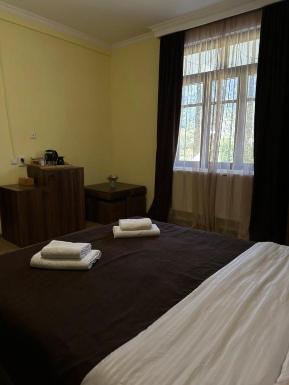 Llit o llits en una habitació de Guest House Mukha