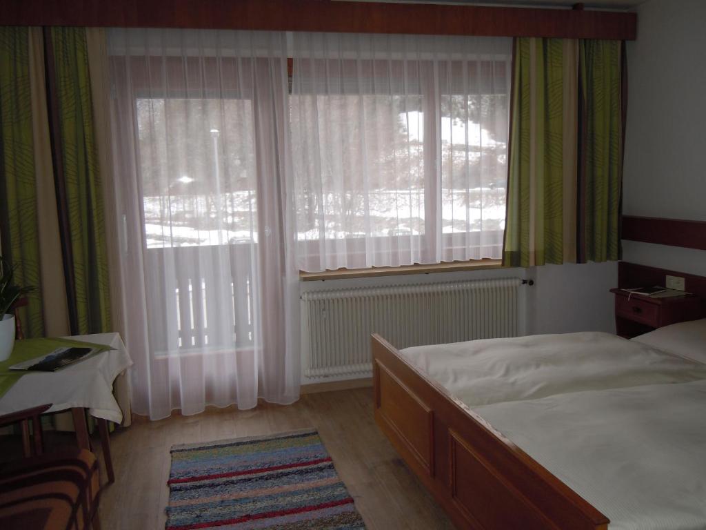 Postel nebo postele na pokoji v ubytování Haus Kristall