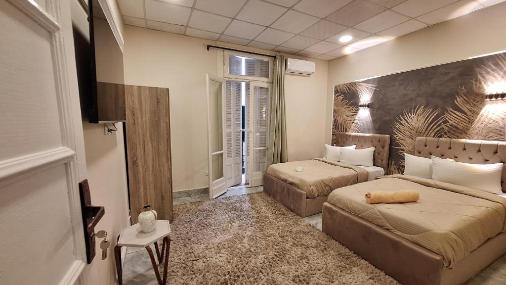 Postel nebo postele na pokoji v ubytování Cairo Downtown Apartments