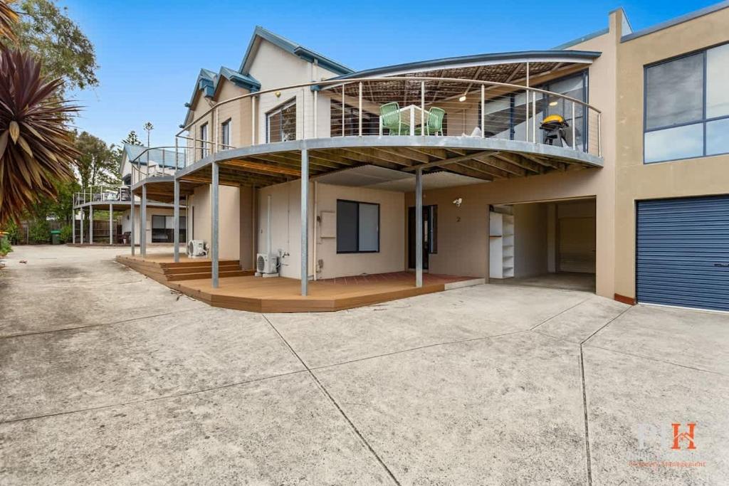 a large house with a balcony on top of it at Amazing Location with Ocean View in Cowes