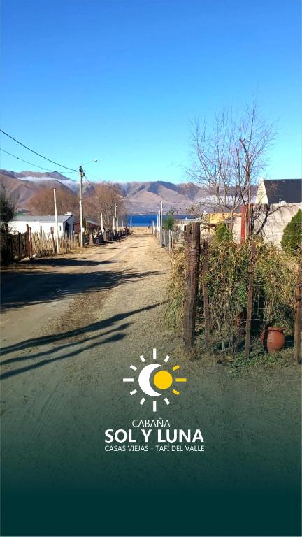 a sign on the side of a road with a sun at Cabaña Sol&Luna in Tafí del Valle