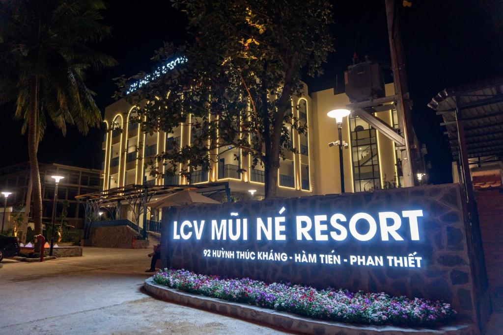 a sign that says key win me resort in front of a building at LCV Mũi Né Resort in Mui Ne