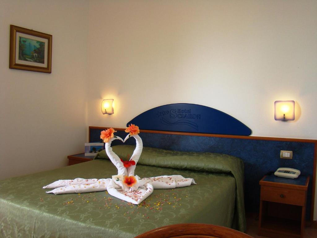 Postel nebo postele na pokoji v ubytování Hotel Residence Sciaron