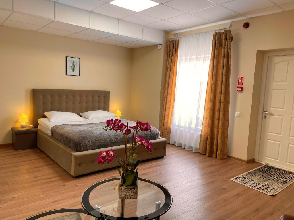 Postel nebo postele na pokoji v ubytování SPA&Hotel MŪSA PARADISE