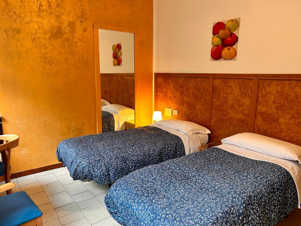 Postel nebo postele na pokoji v ubytování Hotel Moderno