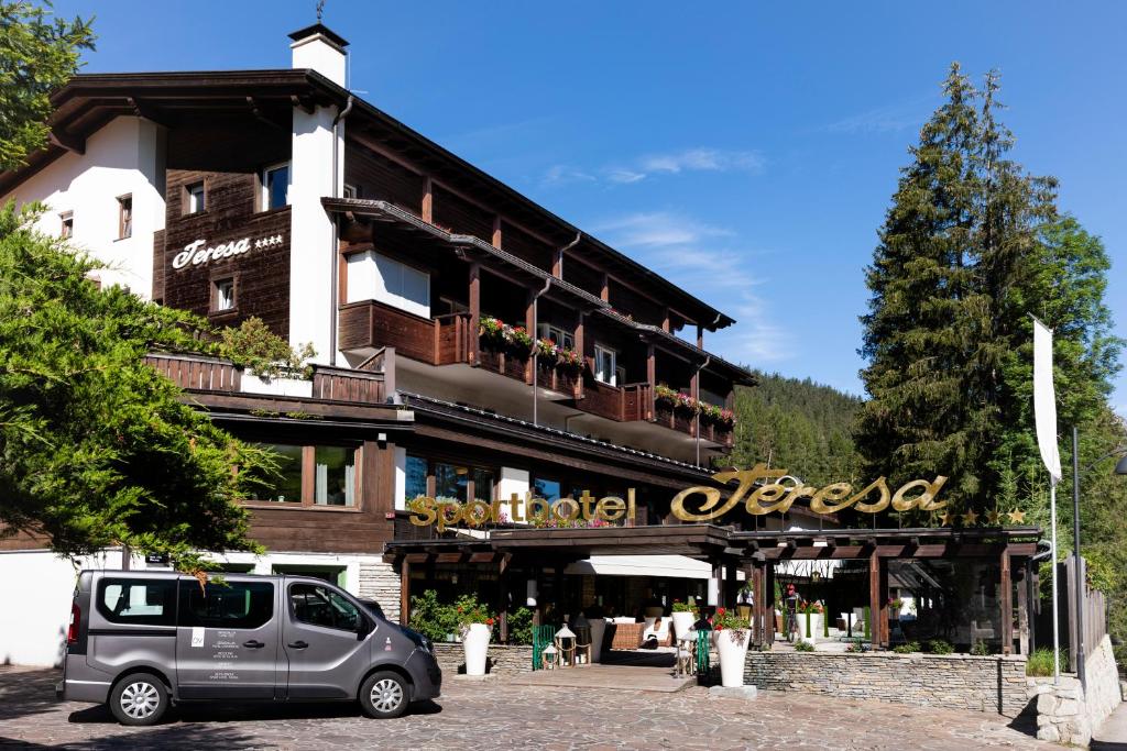 a car parked in front of a building at Sporthotel Teresa in Badia