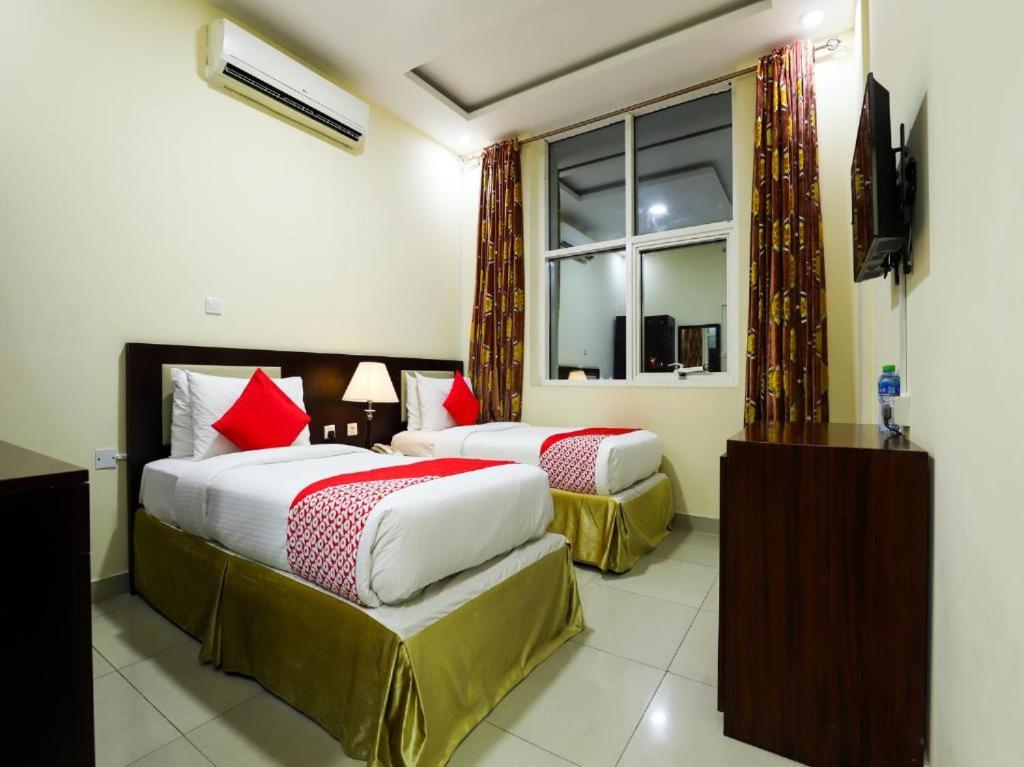 Ένα ή περισσότερα κρεβάτια σε δωμάτιο στο SH Hotel