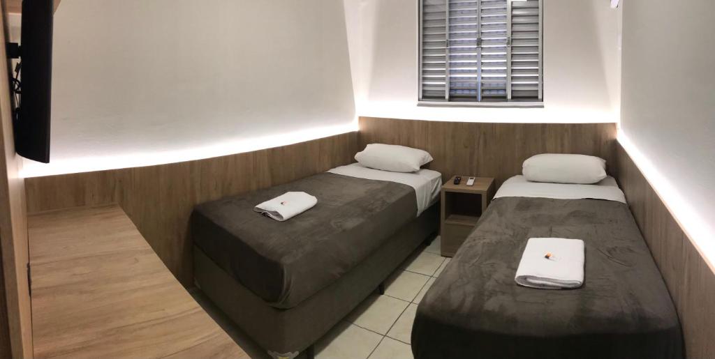 Postel nebo postele na pokoji v ubytování Ipê Hotel Curitiba - Aeroporto