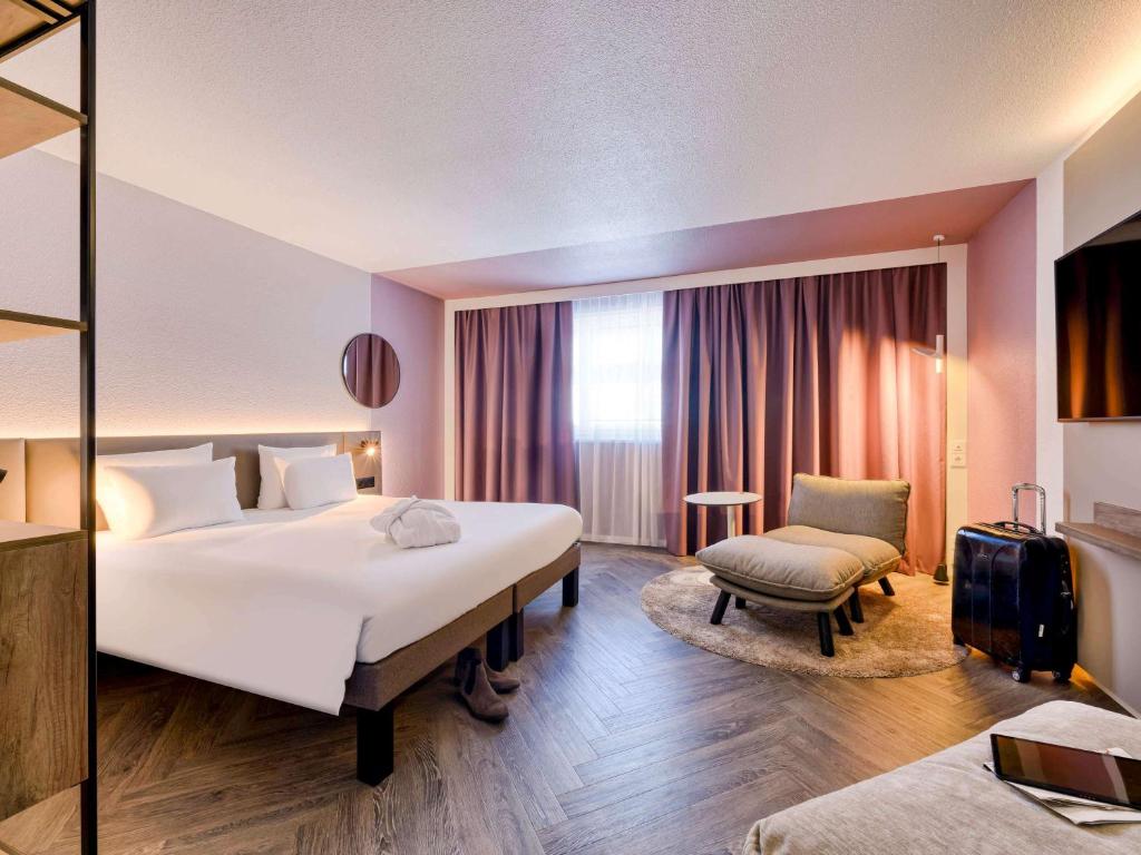 Postel nebo postele na pokoji v ubytování Novotel Zurich City West