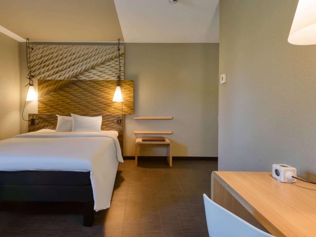 Llit o llits en una habitació de ibis Zürich City West