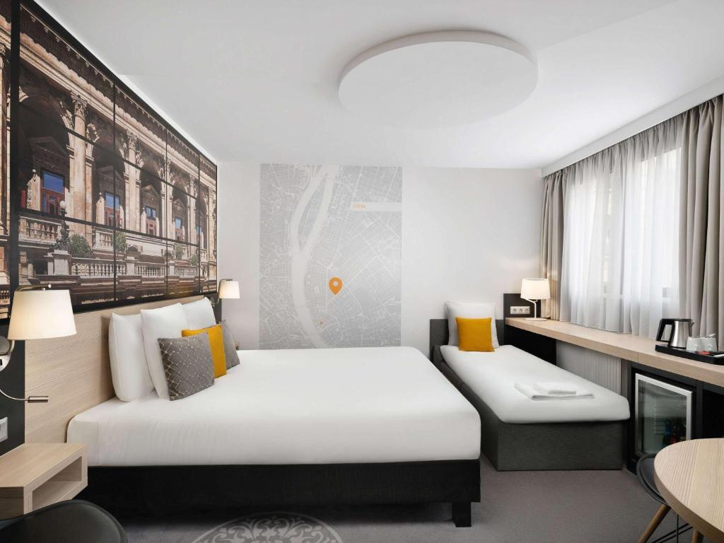 Postel nebo postele na pokoji v ubytování Mercure Budapest City Center