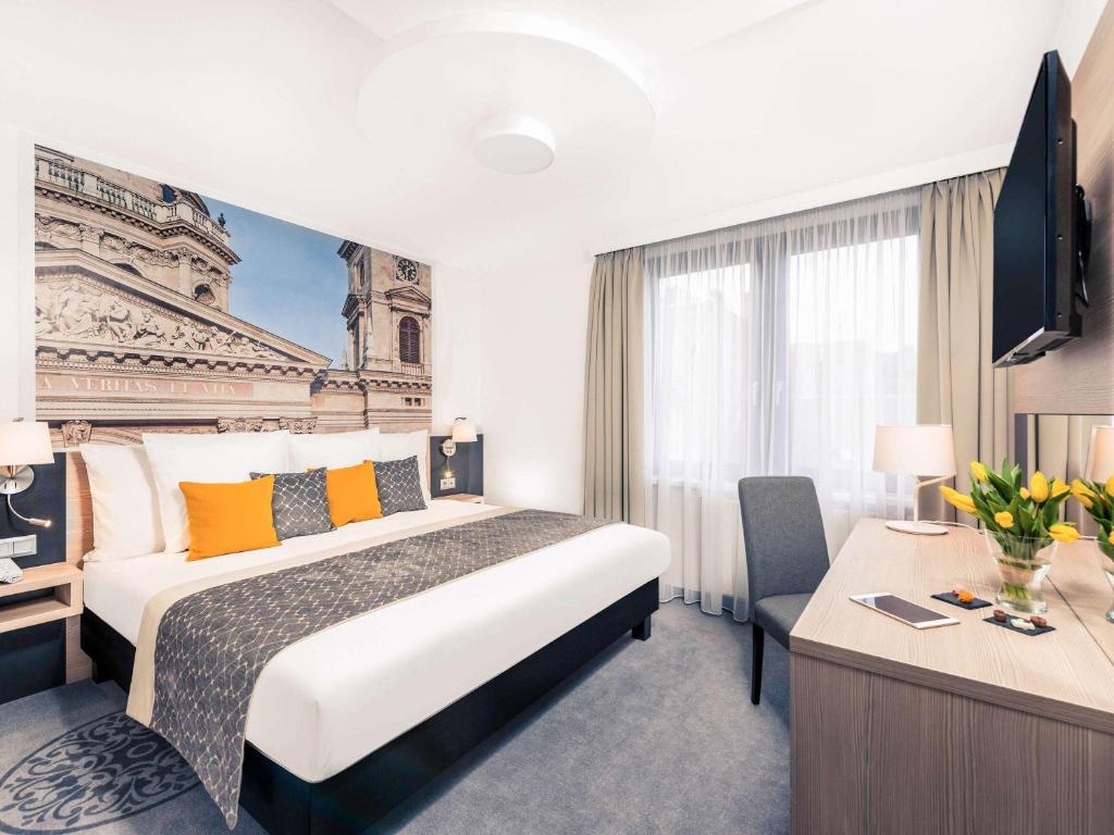 Postel nebo postele na pokoji v ubytování Mercure Budapest City Center