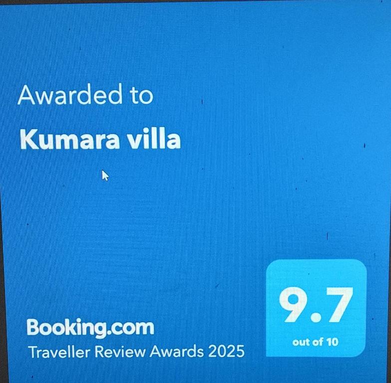 a blue sign that says awarded to kivanzona villilla at Kumara villa in Hikkaduwa