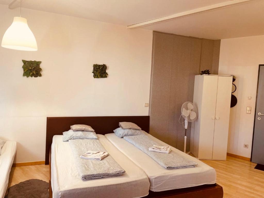 Postel nebo postele na pokoji v ubytování Veni Apartments