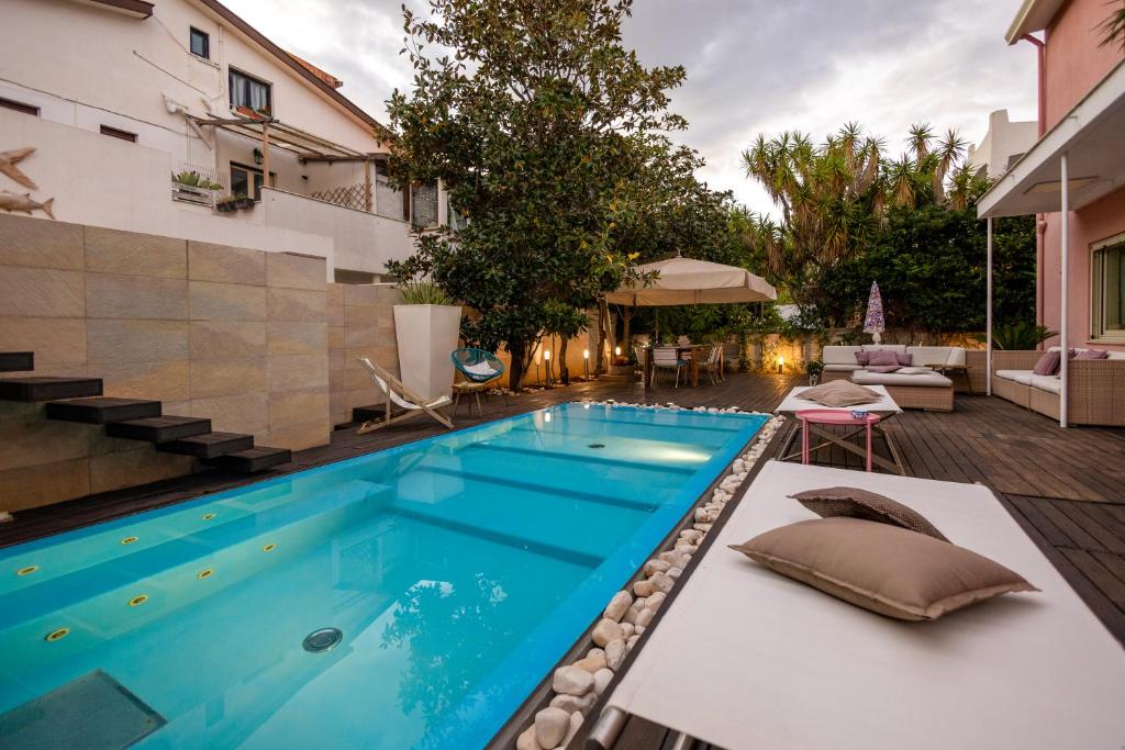 a swimming pool in the middle of a house at Villa Olimpia in Mondello