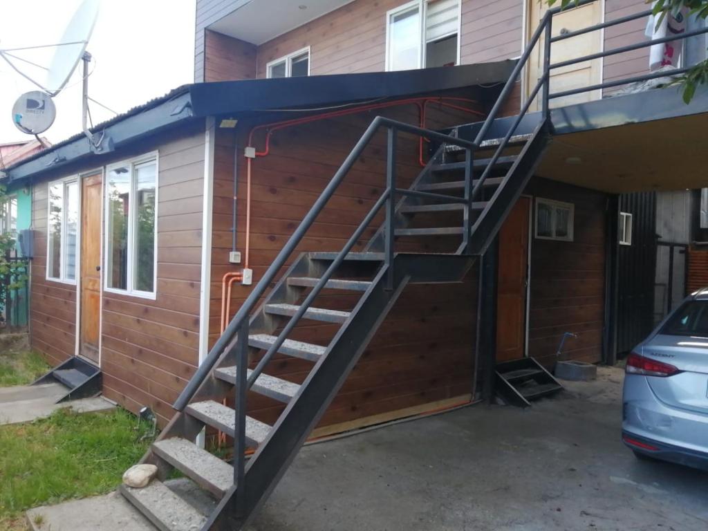 a staircase leading into a house with a garage at Rincón Puyehue Primer Nivel in Puyehue