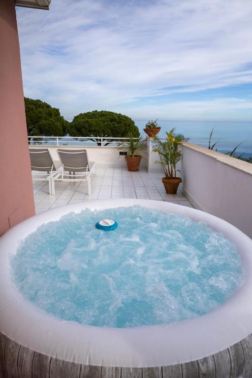 a jacuzzi tub on the roof of a house at Villa Olimpia in Mondello