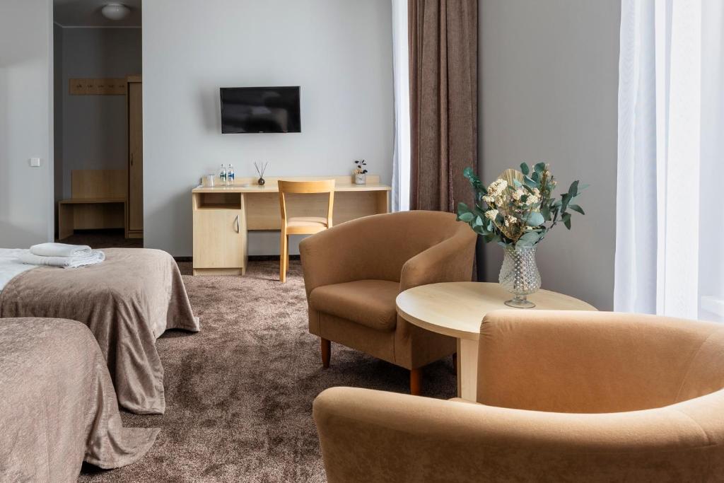 TV a/nebo společenská místnost v ubytování Domus Hotel