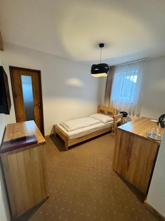 Postel nebo postele na pokoji v ubytování Hotel Palatín