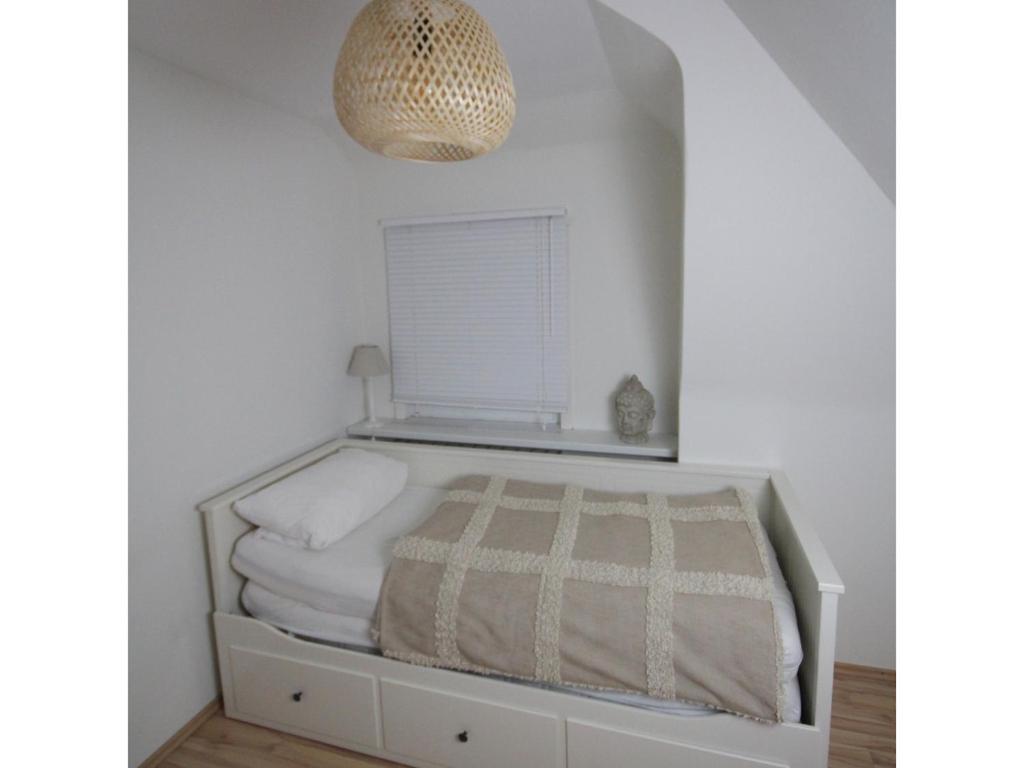 Postel nebo postele na pokoji v ubytování Ferienwohnung Waldblick