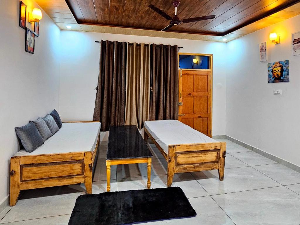 Postel nebo postele na pokoji v ubytování Mysuru Villa