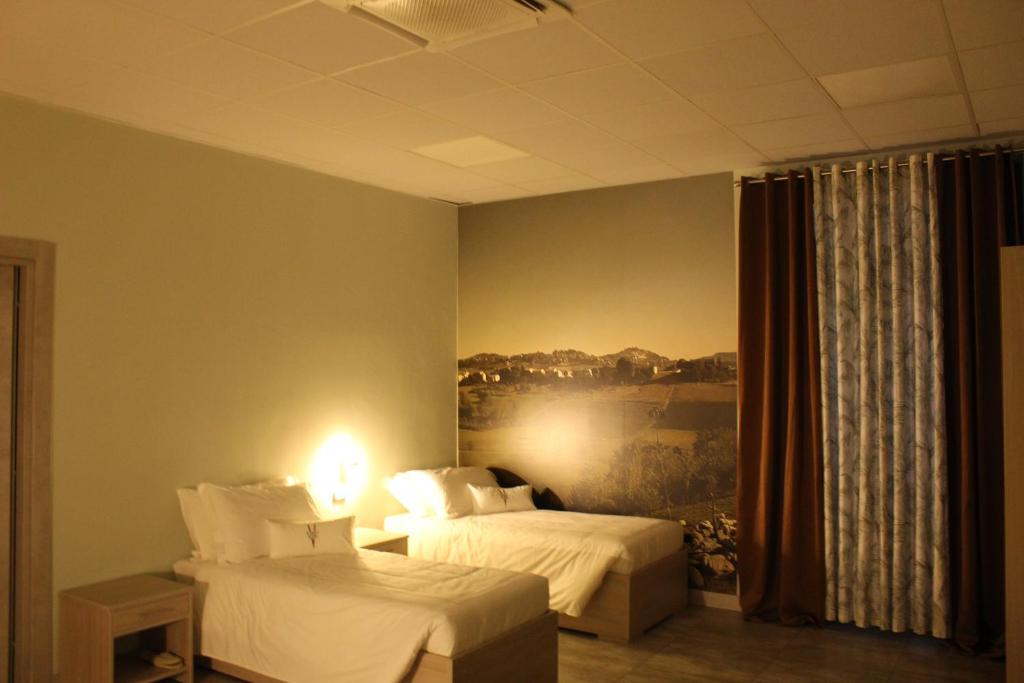 Postel nebo postele na pokoji v ubytování Volpedo hostel