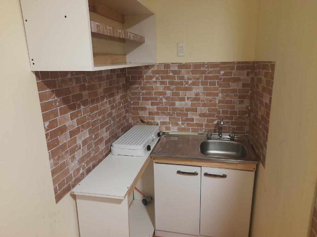 Kuchyň nebo kuchyňský kout v ubytování Nuevo Hostal Consulado