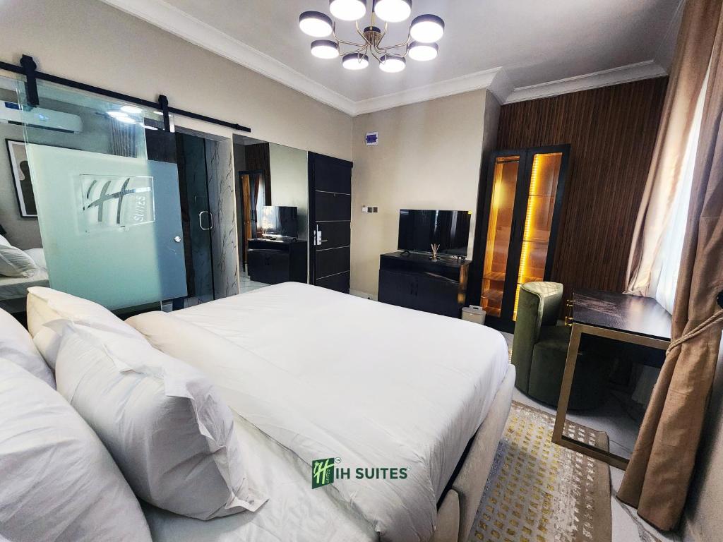 Postel nebo postele na pokoji v ubytování Ihsuites