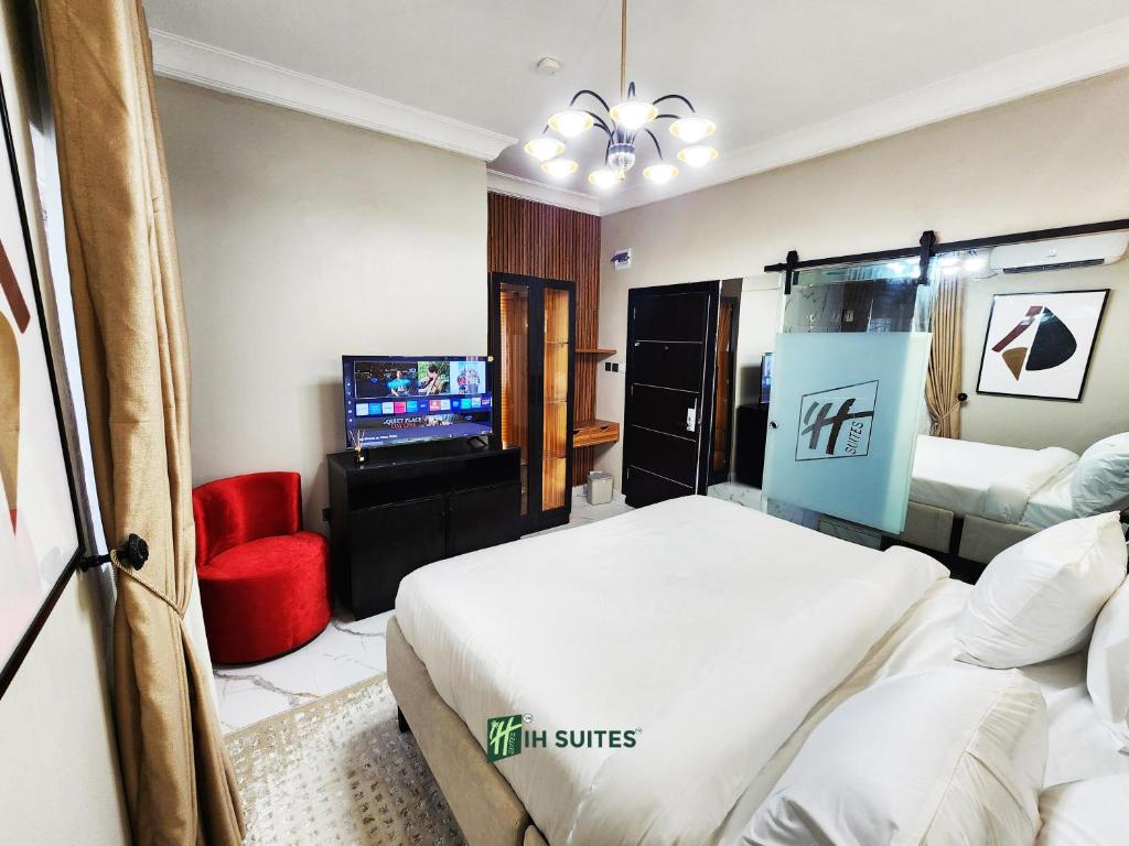 Postel nebo postele na pokoji v ubytování Ihsuites