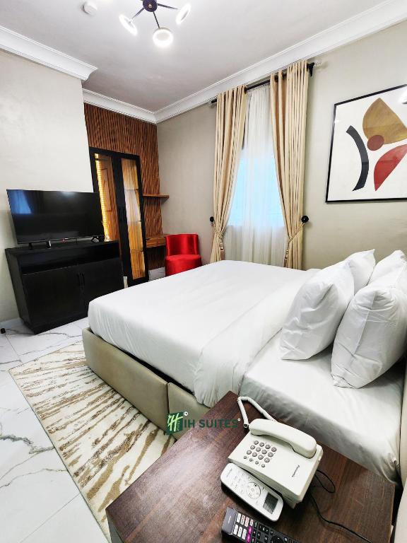 TV a/nebo společenská místnost v ubytování Ihsuites