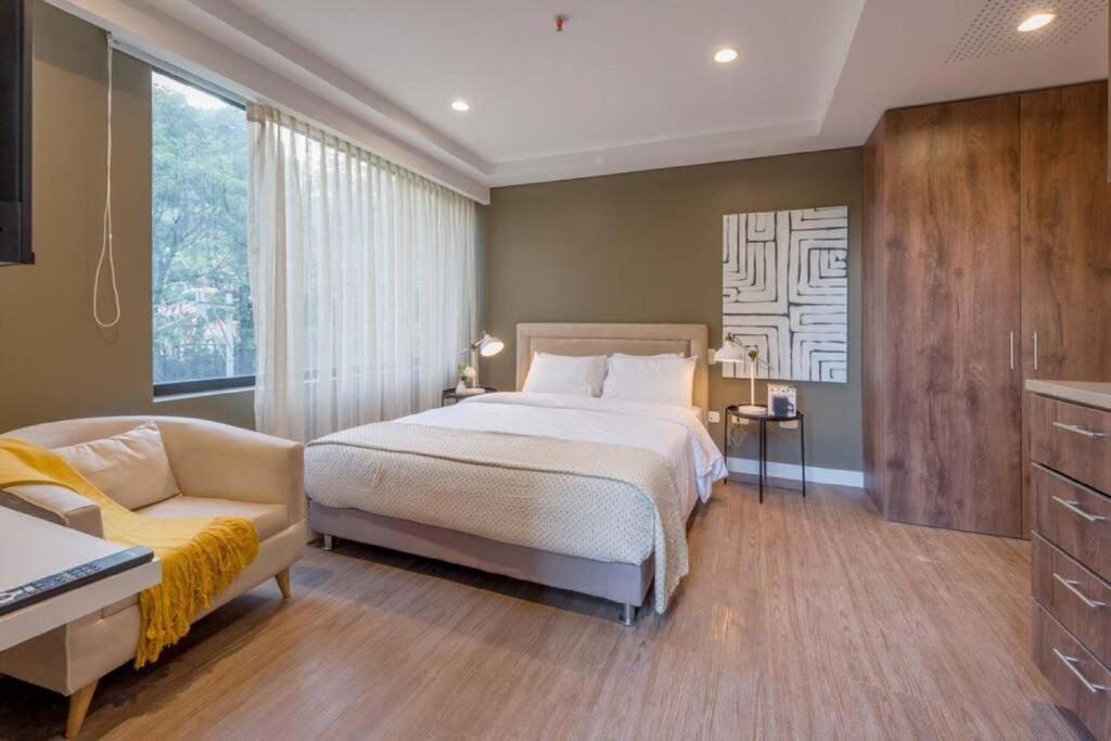 Voodi või voodid majutusasutuse El Tesoro Medellín Hab309 by Letoh toas