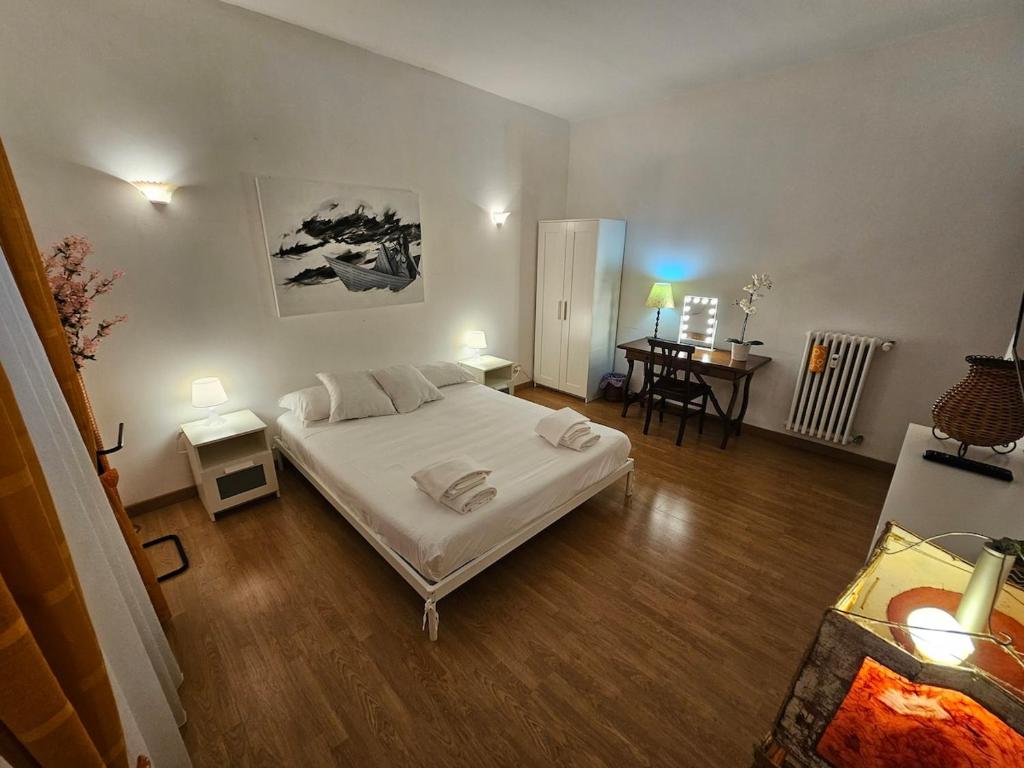 a bedroom with a bed and a desk in it at Private SPA Apartment in Rome in Rome