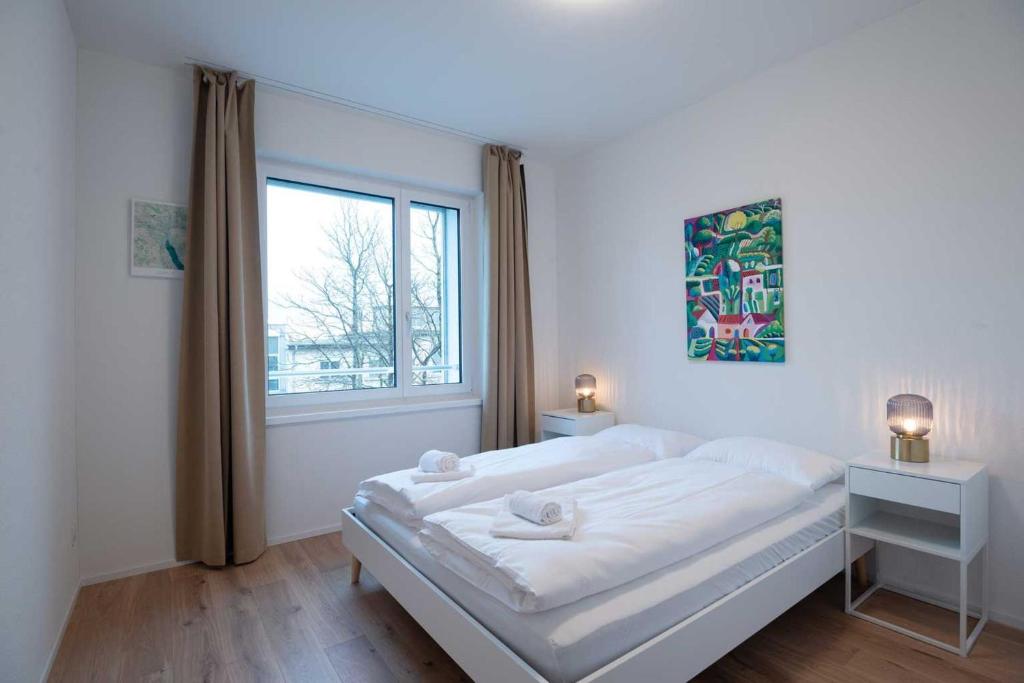Posteľ alebo postele v izbe v ubytovaní HITrental Letzigrund - Apartment