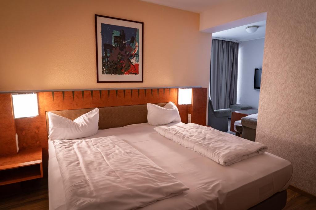 Postel nebo postele na pokoji v ubytování Hotel Martina
