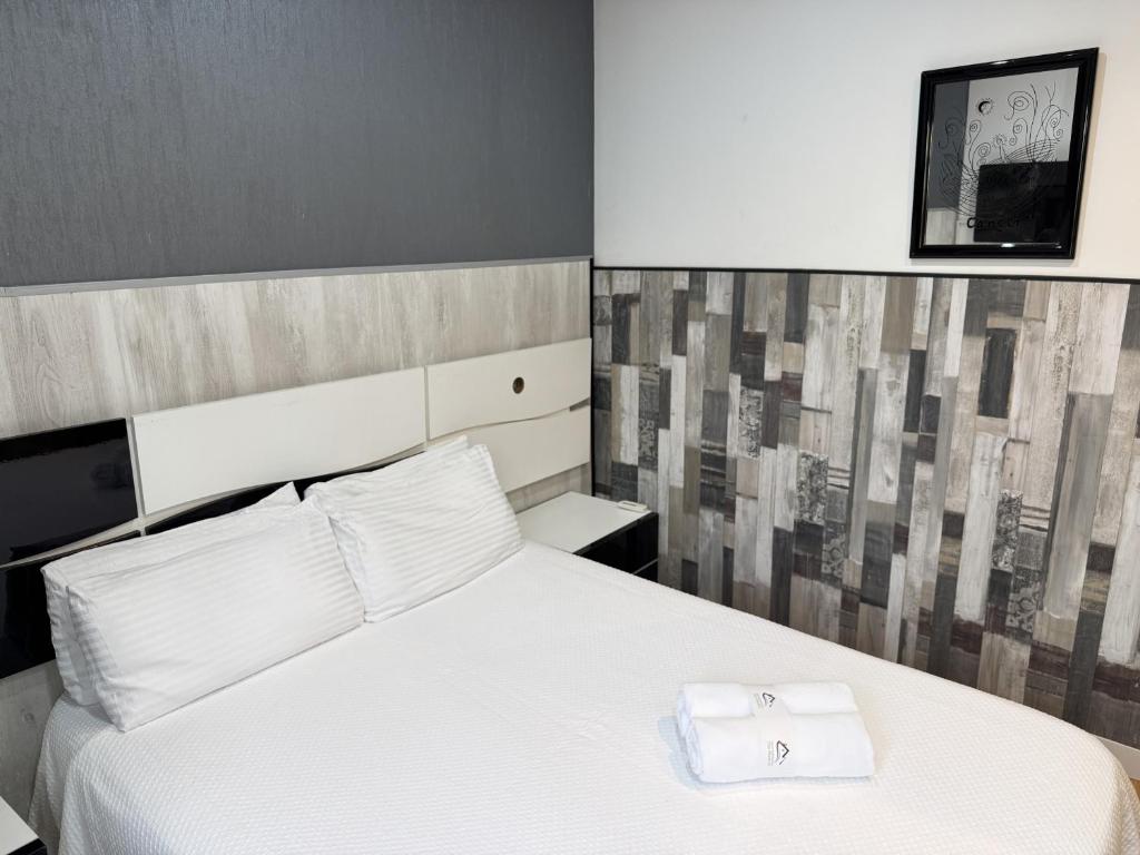 A bed or beds in a room at Apartamentos Day Madrid ILDEFONSO Centro Gran Via Sol Malasaña