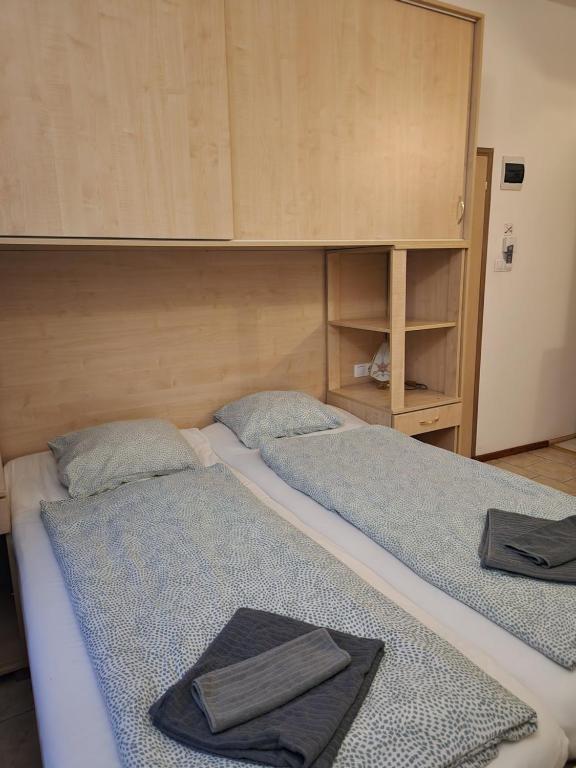 Postel nebo postele na pokoji v ubytování Borbarátok Háza